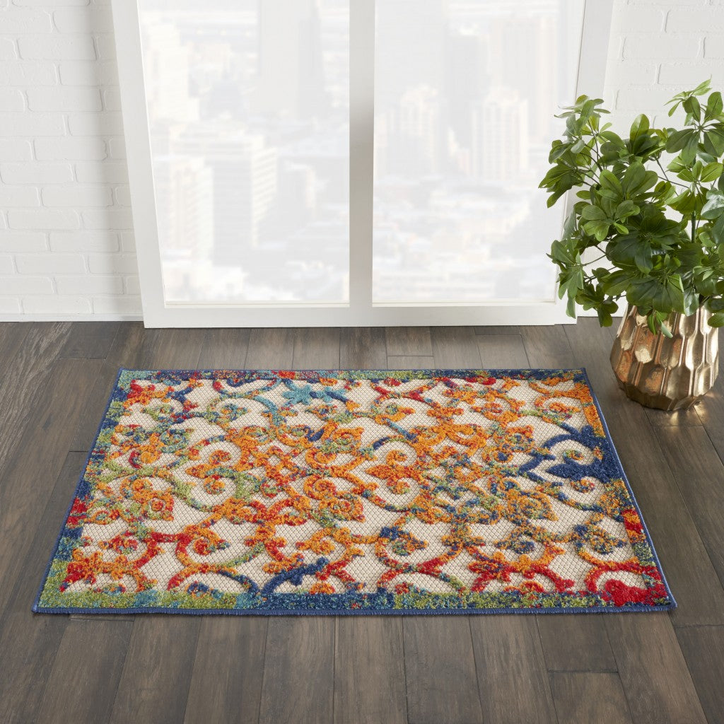5' X 8' Ivory And Blue Floral Indoor Outdoor Area Rug